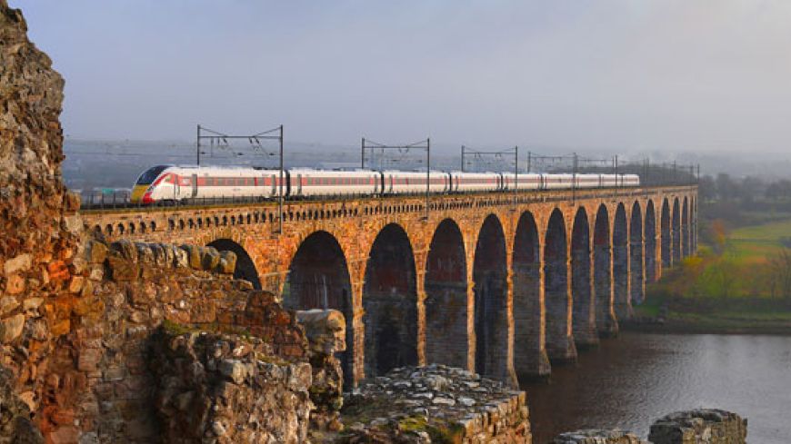 Azuma train crossing a bridge