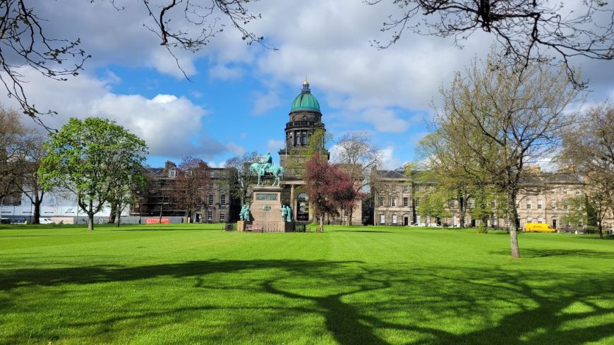 Charlotte Square Garden with the green dome of West Register House rising above equestrian statue Prince Albert