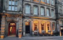 The front of One India Buildings on Victoria Street in the evening 