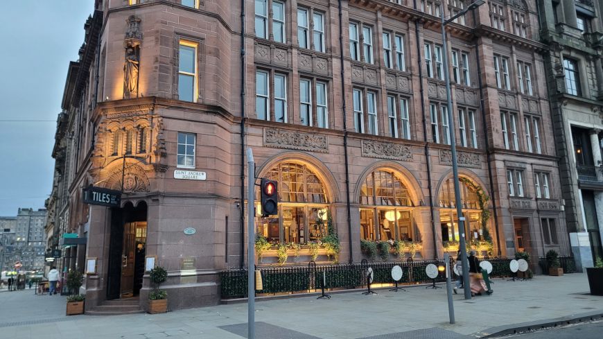 Rouge fronted stone of the Tiles bar building at night on St Andrew Square   