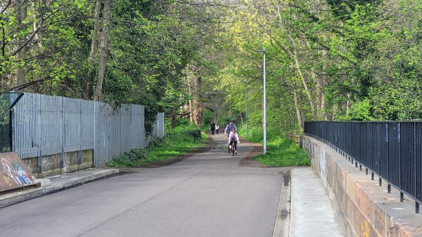 Cyclists cross the Coltbridge Viaduct in Roseburn