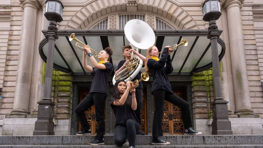Isabella O'Sullivan, Heiyi Lok, Alex Wishart and Summer Williamson from Oi Musica perform outdoors at Usher Hall to announce details of the Healing Arts Scotland Opening Celebration as part of EIF 2024. 