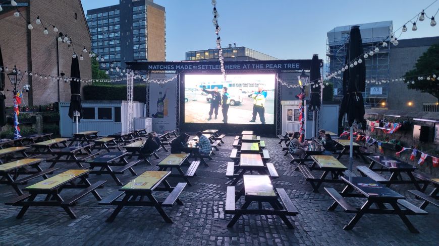 Big screen in the Pear Tree beer garden