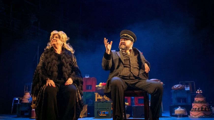 L-R: Sitting, gazing at the world are Elaine C Smith as Mrs Puntila and Steven McNicoll as Matti.