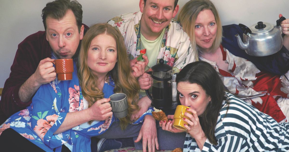 The five cast members of Bite-Sized plays pose with cups of tea
