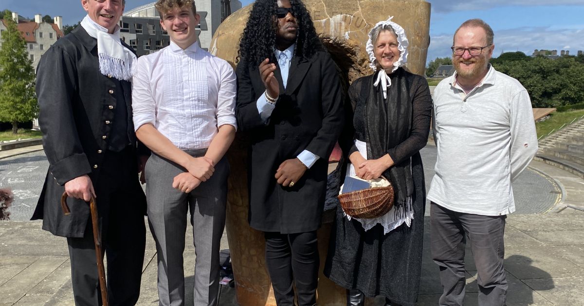 The cast of Darwin in Edinburgh pose outside Dynamic Earth