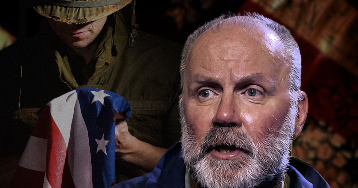 Writer/performer Richard Vergette is pictured looking out, an American flag in the background. Photo by Jane Hobson