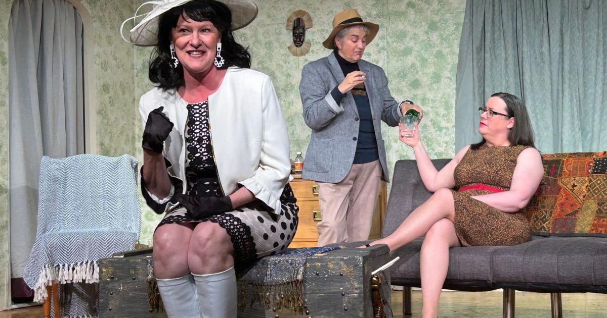 Three of the cast members of The Rats are posed, mid-scene, one to the fore with the other two at the back