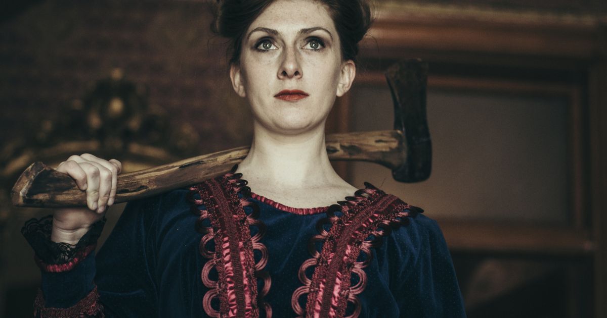 Sasha Wilson as Llizzie Borden, dressed in period costume