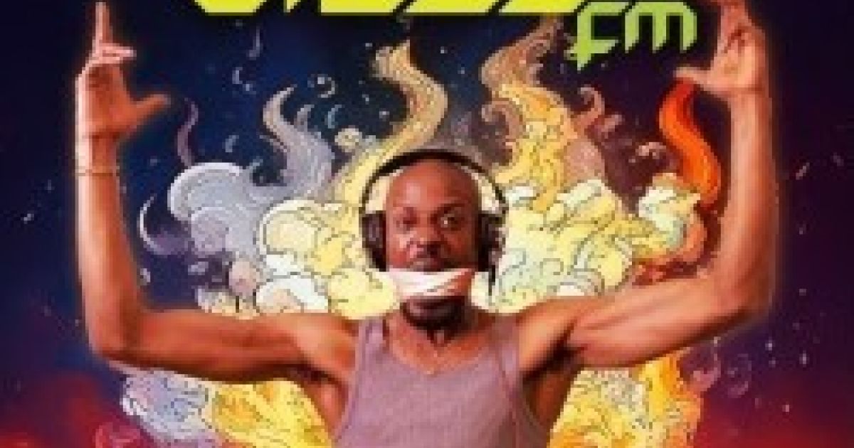 DJ from the show stands with arms up in the air, the words Blaze FM at the top, surrounded by fire.