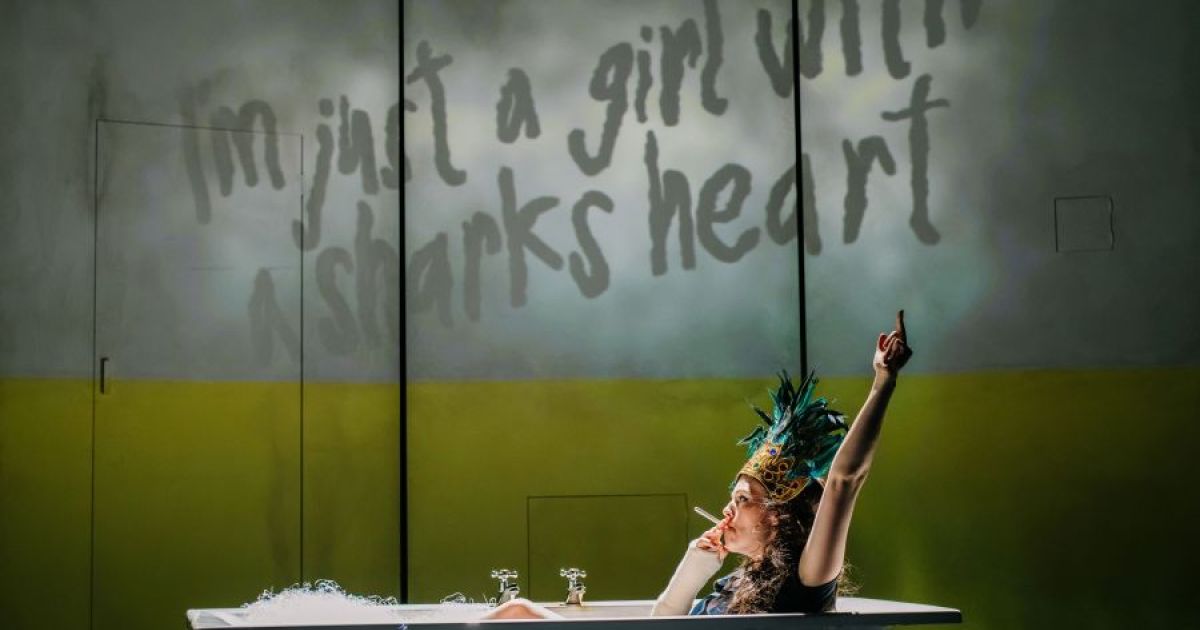 Anna Russell-Martin as Anais, lying in a bath, imagining "I'm just a girl with a shark's heart@. Image by Mihaela Bodlovic.